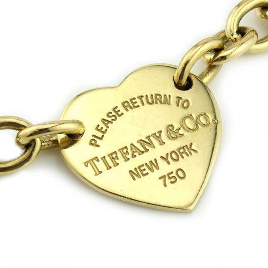 Tiffany and Co 18ct Yellow Gold Bracelet; with "Please return to Tiffany & Co New York" heart charm, Circa 2013, in original Tiffany & Co box