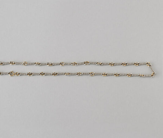 Chaumet Vintage 18ct Yellow Gold and Silver Chain; gold round links alternated with twisted silver links. Signed and numbered, Circa 1970