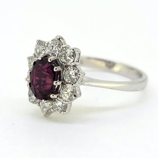 Natural No Heat Ruby and Diamond Cluster Engagement Ring, oval-cut Thai ruby with no indication of heat treatment surrounded by 1ct sparkling round brilliant-cut diamonds in 18ct white gold