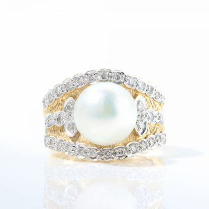 Vintage 1950s Pearl and Diamond Dress Ring; wide 18ct yellow gold cocktail ring set with a central freshwater pearl accented with 0.72cts diamonds. Circa 1950s-1960s