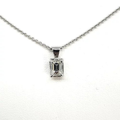 Emerald Cut Diamond Pendant; single stone diamond pendant featuring a 0.53 carat emerald-cut diamond four-claw set in 18ct white gold