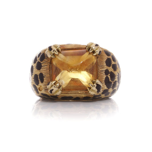 Dior cocktail ring with a sugarloaf cabochon-cut citrine, held by paw prongs in gold with black enamel leopard spots.