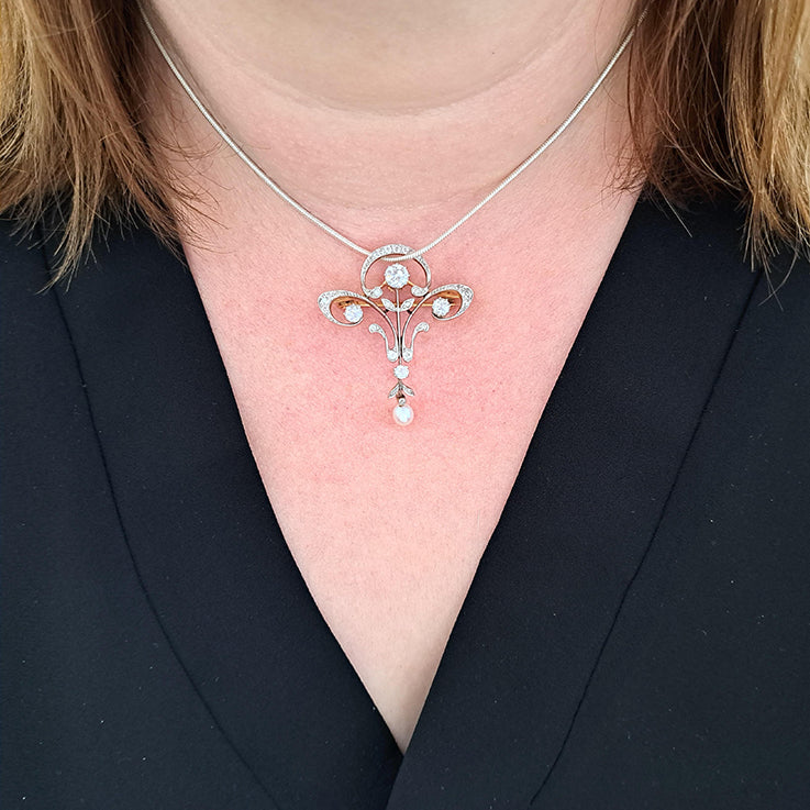 Antique Art Nouveau 1.60ct Old Cut Diamond and Pearl Pendant come Brooch in platinum upon yellow gold. Circa 1870