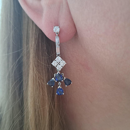 Image of sapphire and diamond earrings on ear model vintage antique