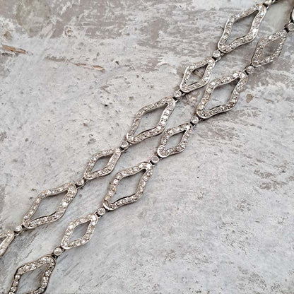 Art Deco Ruby Emerald Diamond Pendant Sautoir Necklace in Platinum, diamond sautoir necklace of alternating sized diamond-shaped links set with single-cut diamonds leading to detachable diamond, ruby and emerald set floral plaque pendant. Circa 1925