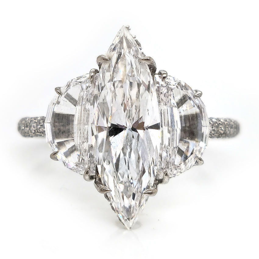 Fine Marquise Diamond Ring with Half Moon Shoulders, 1.67ct marquise-cut diamond flanked by a half moon diamond either side in platinum with single cut diamonds set to the gallery and three outer edges of the shank
