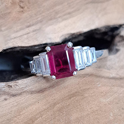 1ct Burma Ruby and Baguette Diamond Engagement Ring, 1.07ct emerald-cut Burmese ruby flanked with graduated stepped baguette-cut diamonds in platinum