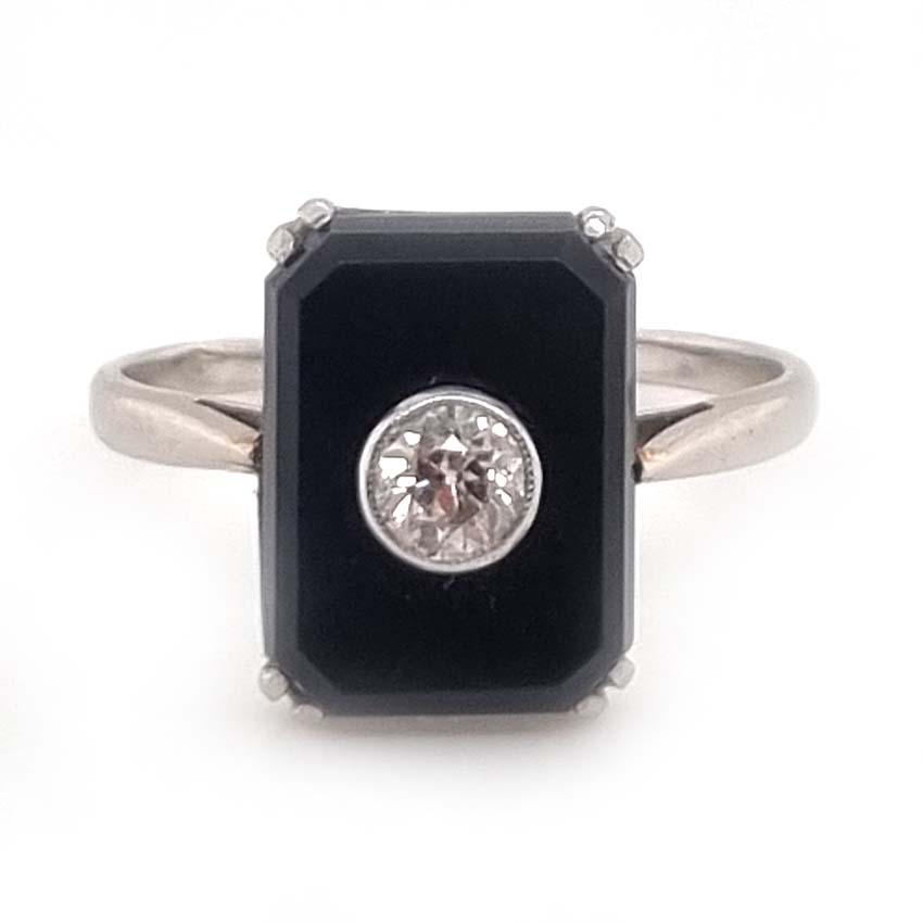 Art Deco Old Cut Diamond and Onyx Plaque Tablet Ring, emerald-cut black onyx tablet with central 0.25ct old European-cut diamond in platinum. French Circa 1920