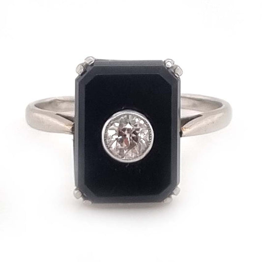 Art Deco Old Cut Diamond and Onyx Plaque Tablet Ring, emerald-cut black onyx tablet with central 0.25ct old European-cut diamond in platinum. French Circa 1920