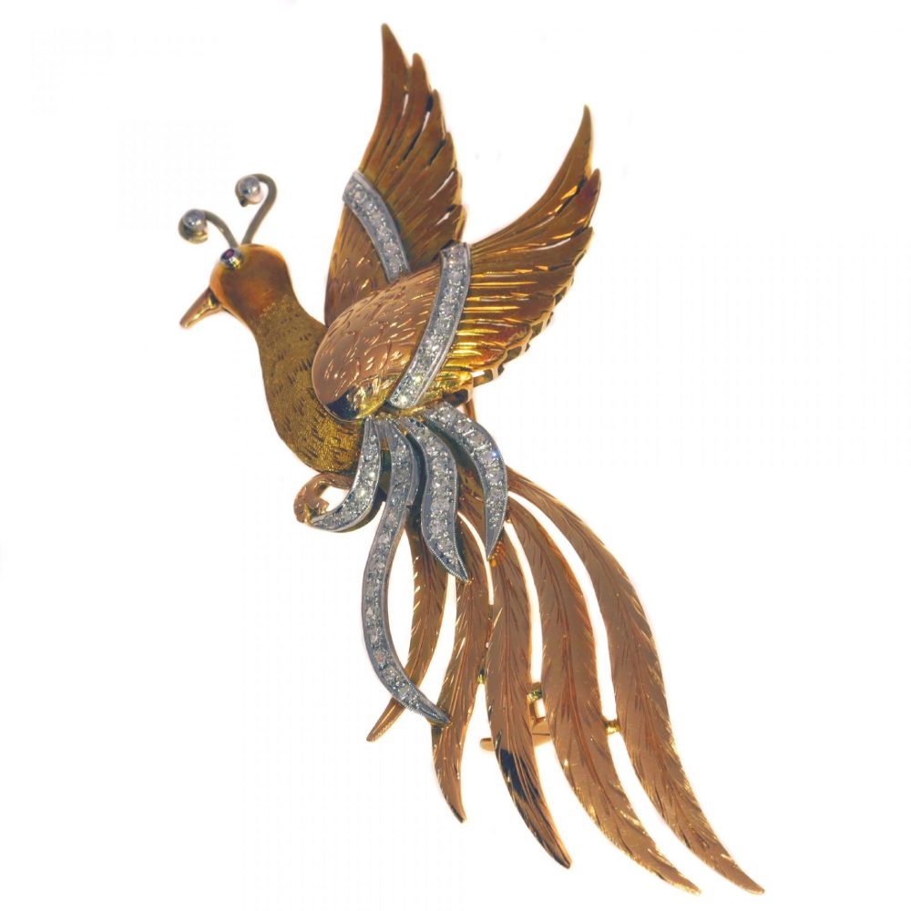 Vintage Tri Colour Gold Bird of Paradise Brooch with Diamonds; 18ct yellow, white and rose gold bird of paradise with 0.80cts diamonds and ruby eye, Circa 1950