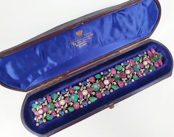 Vintage Tutti Frutti Gem Stone Bracelet; with carved emeralds, sapphires and rubies, diamonds and pearls, in white gold. Circa 1950s