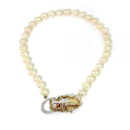 Vintage South Sea Pearl Necklace with Diamond Set Dragons Head Clasp; the striking 14ct yellow gold clasp in the form of a dragon's head is decorated with diamonds and ruby eyes, Circa 1970s