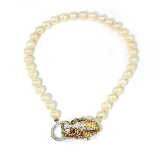 Vintage South Sea Pearl Necklace with Diamond Set Dragons Head Clasp; the striking 14ct yellow gold clasp in the form of a dragon's head is decorated with diamonds and ruby eyes, Circa 1970s