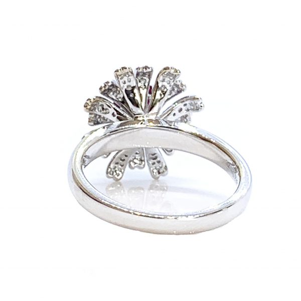 Burmese Ruby and Diamond Flower Cluster Dress Ring; 1.28ct oval faceted Burma ruby surrounded by diamond-set petals, in 18ct white gold