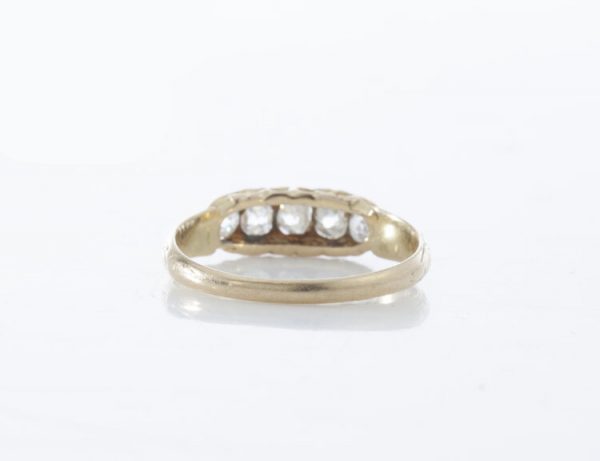 Antique Victorian Old Cut Diamond Five Stone Ring; set with five graduating old-cut diamonds, in 15ct yellow gold. Made in England, Circa 1860s