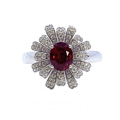 Burmese Ruby and Diamond Flower Cluster Dress Ring; 1.28ct oval faceted Burma ruby surrounded by diamond-set petals, in 18ct white gold