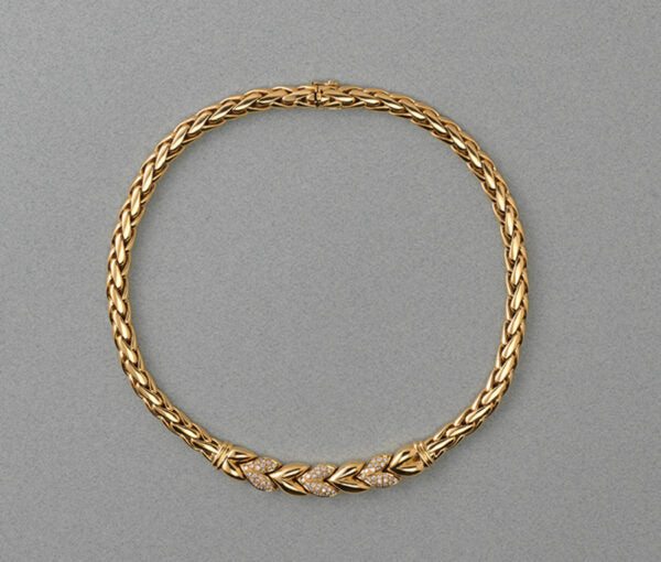 Vintage Steltman 18ct yellow gold rope necklace with six stylised leaves, three of which are set with 1.50cts brilliant cut diamonds, Signed, Circa 1980.