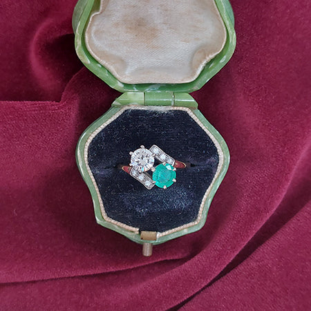 Late Art Deco 0.65ct Diamond and Emerald Toi et Moi Two Stone Crossover Engagement Ring, Circa 1930