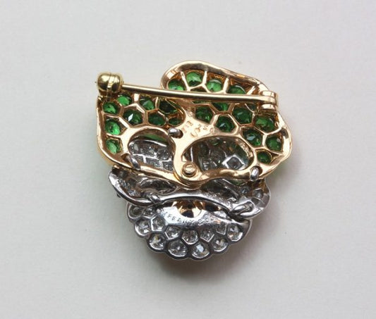 Vintage Tiffany and Co Diamond, Tsavorite Garnet and Sapphire Pansy Flower Brooch; set with 1.10ct tsavorite garnets and 2.10cts brilliant diamonds, Signed