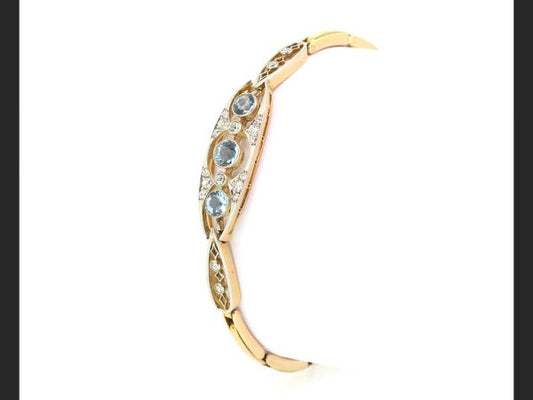 Edwardian Aquamarine and Diamond Panel Bracelet; Three round cut aquamarines accentuated by round cut diamonds, expanding strap, c.1910, 15ct gold