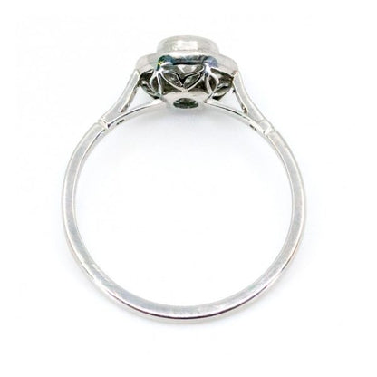 This lovely engagement vintage Art Deco revivalist design ring features a 0.40ct (H SI1) brilliant cut diamond decorated with 0.25ct single cut diamonds crafted in platinum.