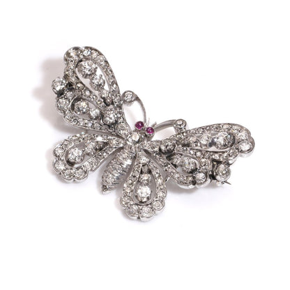 Antique white gold and silver butterfly brooch with diamonds and rubies.