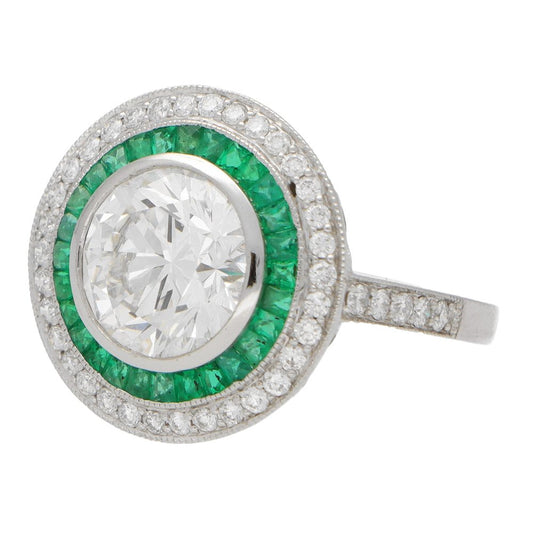 Diamond and emerald double target ring in platinum.