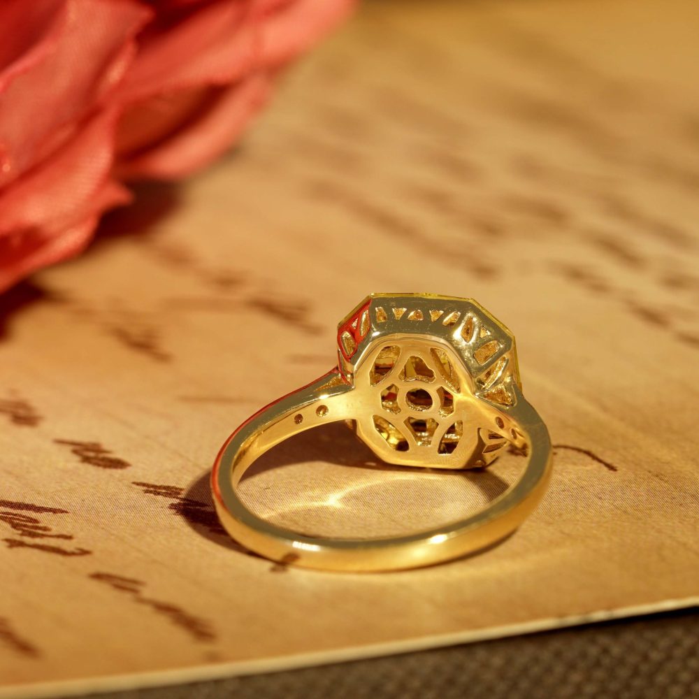 Yellow Sapphire Octagonal Cluster Solitaire Engagement Ring, 5.27cts yellow sapphires arranged in an invisible setting to produce an octagonal shaped design in 14ct yellow gold with diamond set shoulders