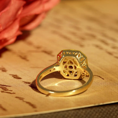 Yellow Sapphire Octagonal Cluster Solitaire Engagement Ring, 5.27cts yellow sapphires arranged in an invisible setting to produce an octagonal shaped design in 14ct yellow gold with diamond set shoulders