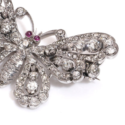 Antique white gold and silver butterfly brooch with diamonds and rubies.